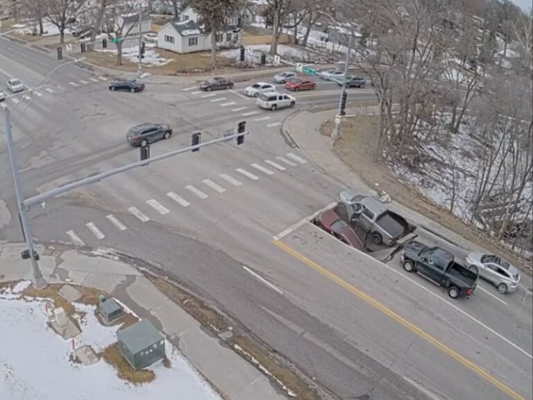 Nebraska Sinkhole Swallows Two Vehicles Near University of Nebraska-Omaha, Security Video Shows Drivers Escaping