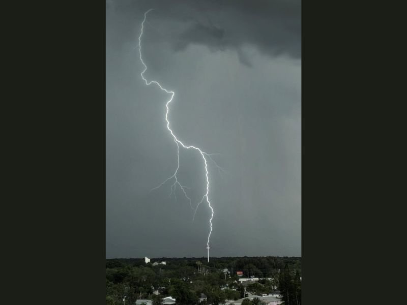 Stunning Lightning Bolt Strikes Church Cross in Largo Florida in a Rare and Dramatically Captured Moment During Active Storm Activity Over the Tampa Bay Region
