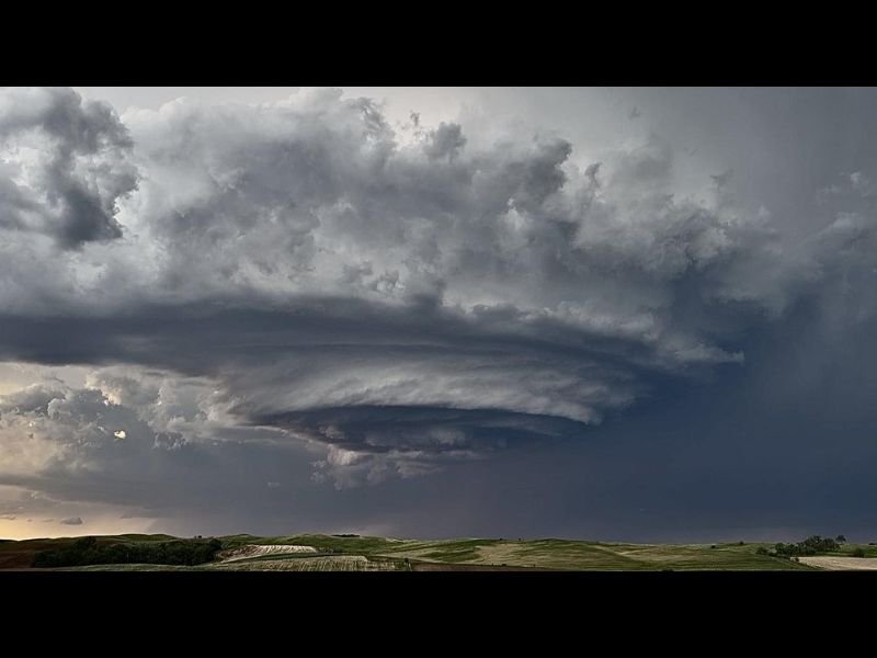 Stunning Supercell Thunderstorm Develops Over Yankton South Dakota Displaying a Perfectly Structured and Visually Spectacular Rotating Wall Cloud Over the Open Plains Landscape